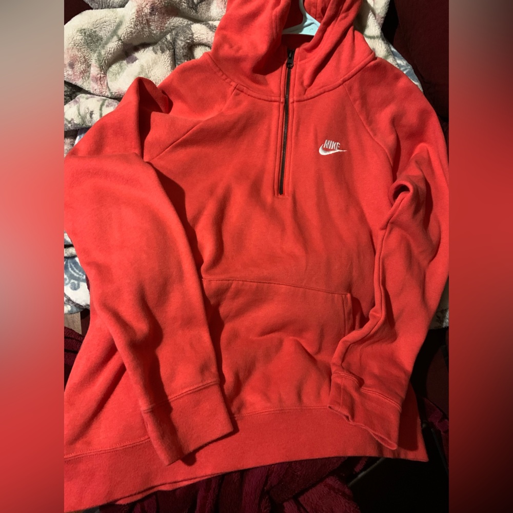 Nike jacket, size L. In great condition. More on the pink/orange side.